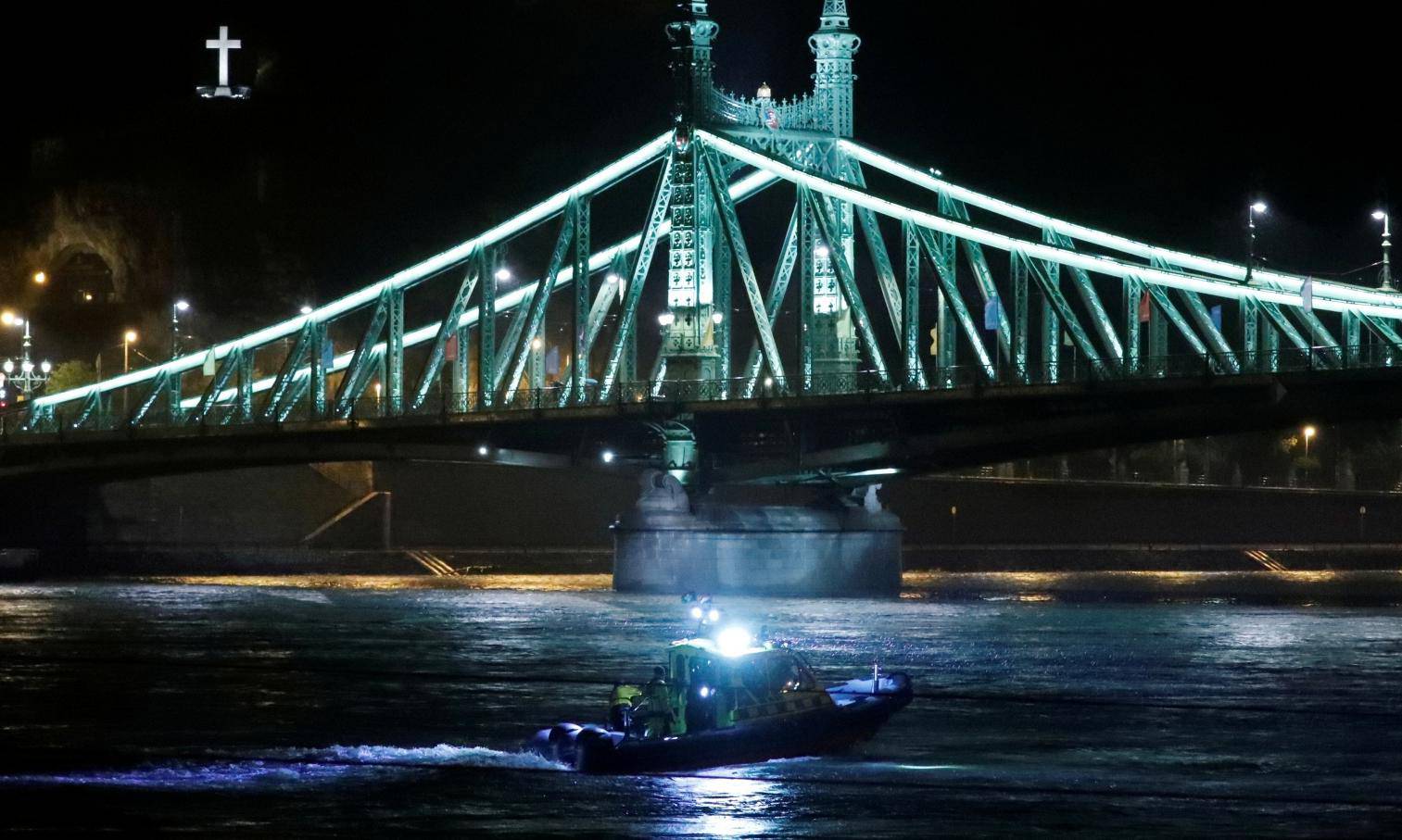A rescue boat is seen on the Danube river after a tourist boat capsizedÂ in Budapest
