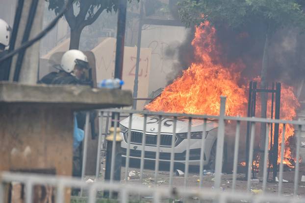 NATO Kosovo Force (KFOR) soldiers clash with local Kosovo Serb protesters in the town of Zvecan