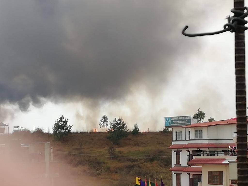 Smoke rises following the crash of a Bangladeshi aircraft at Kathmandu airport