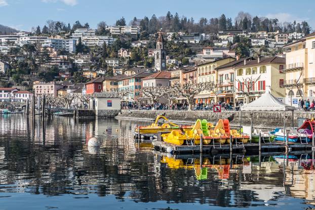 Panorama of Ascona with houses with colorful facades reflecting 
