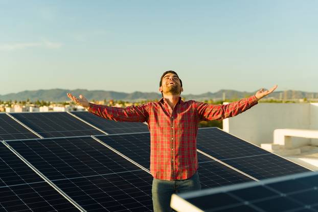 Excited,Young,Man,Smiling,While,Celebrating,Financial,Liberty,By,Saving