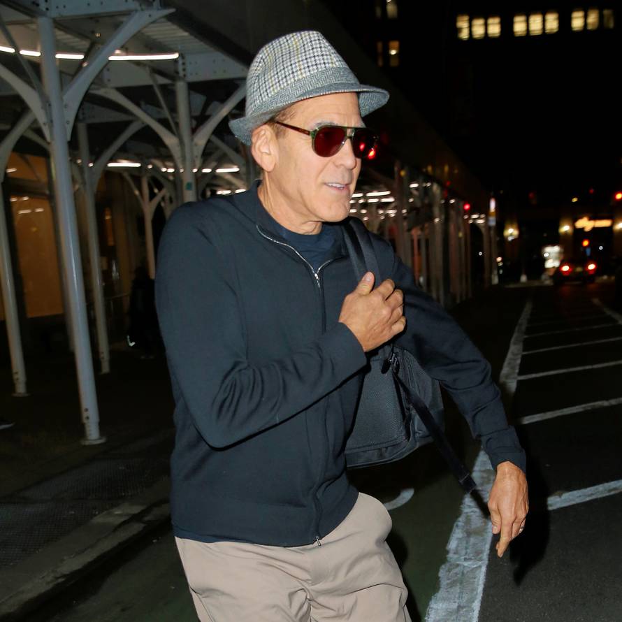 George Clooney cuts a youthful figure in a fedora after rehearsal for 'Good Night and Good Luck' in New York City