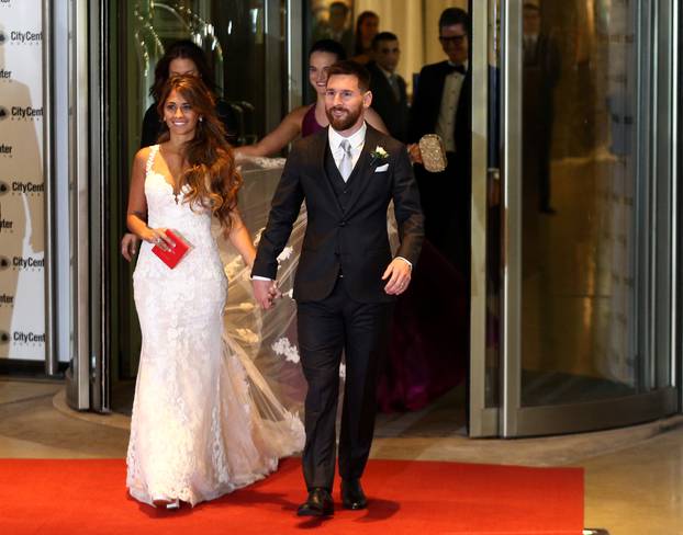 Argentine soccer player Lionel Messi and his wife Antonela Roccuzzo make an appearance for the press at their wedding in Rosario