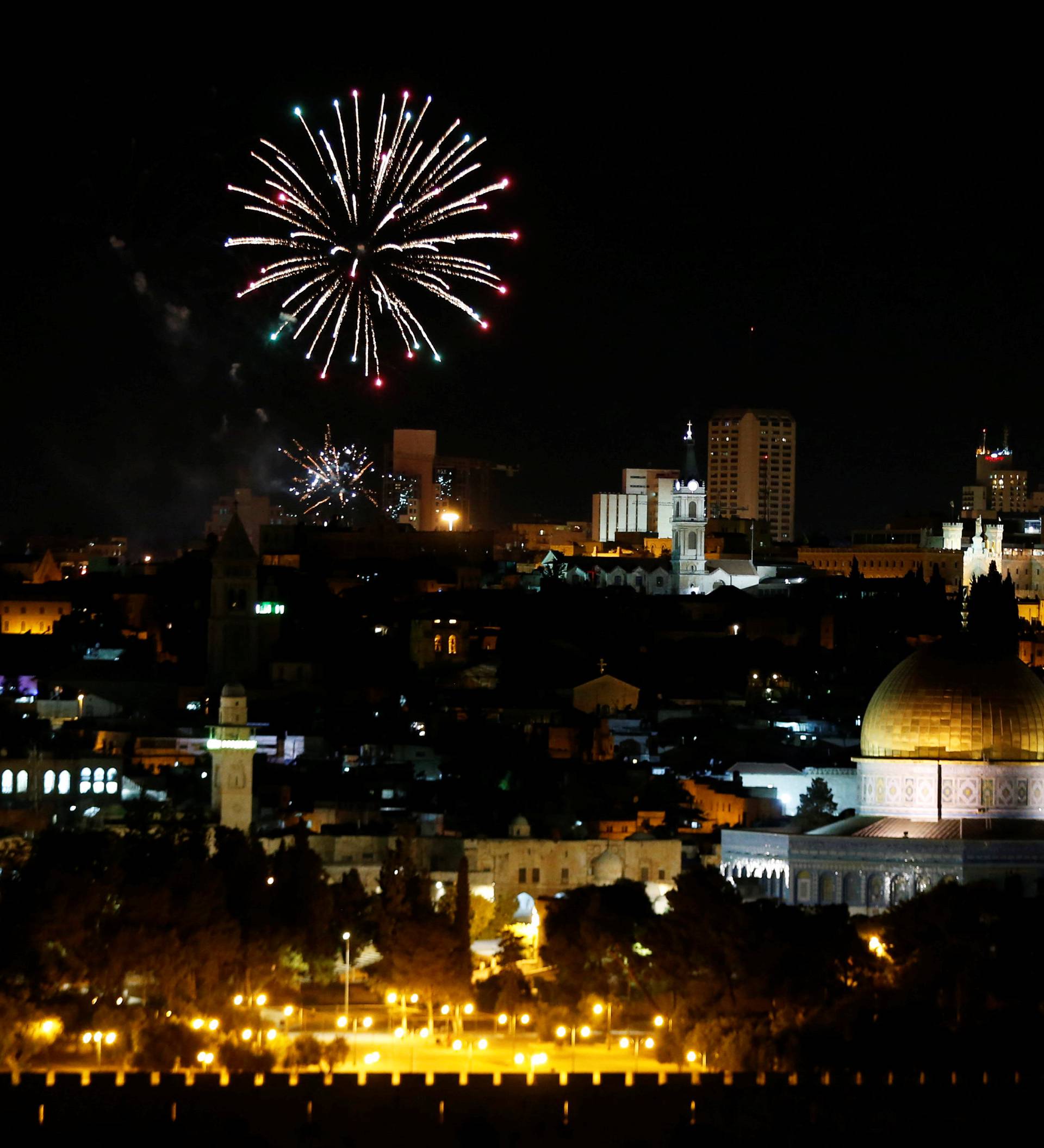 Fireworks explode near Jerusalem's Old City during celebrations for Israel's Independence Day marking the 68th anniversary of the creation of the state