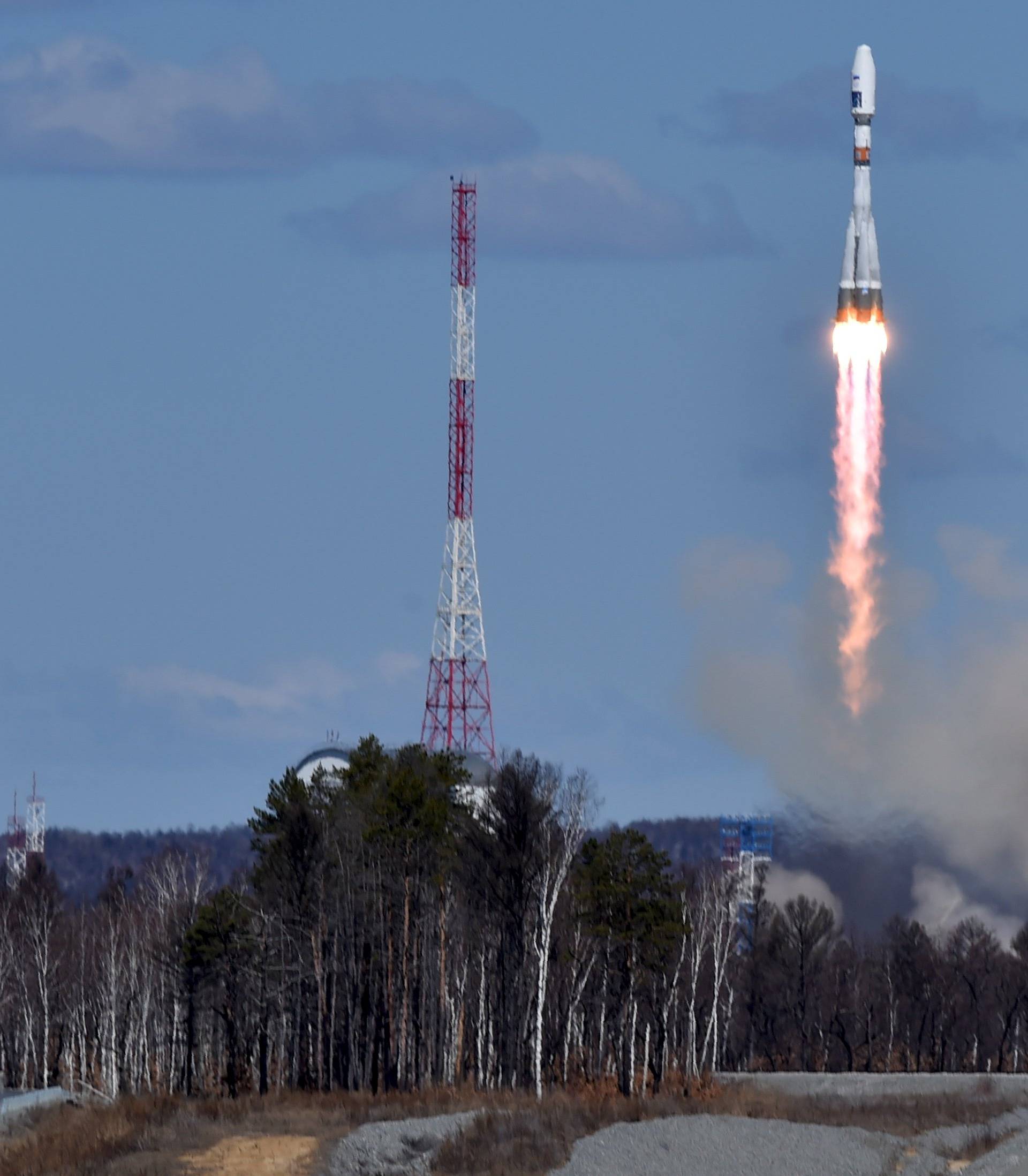 A Russian Soyuz 2.1a rocket carrying Lomonosov, Aist-2D and SamSat-218 satellites leaves a trail of smoke as it lifts off from the new Vostochny cosmodrome outside the city of Uglegorsk