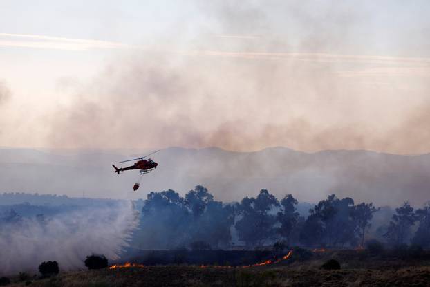 A wildfire burns on the outskirts of Valmojado