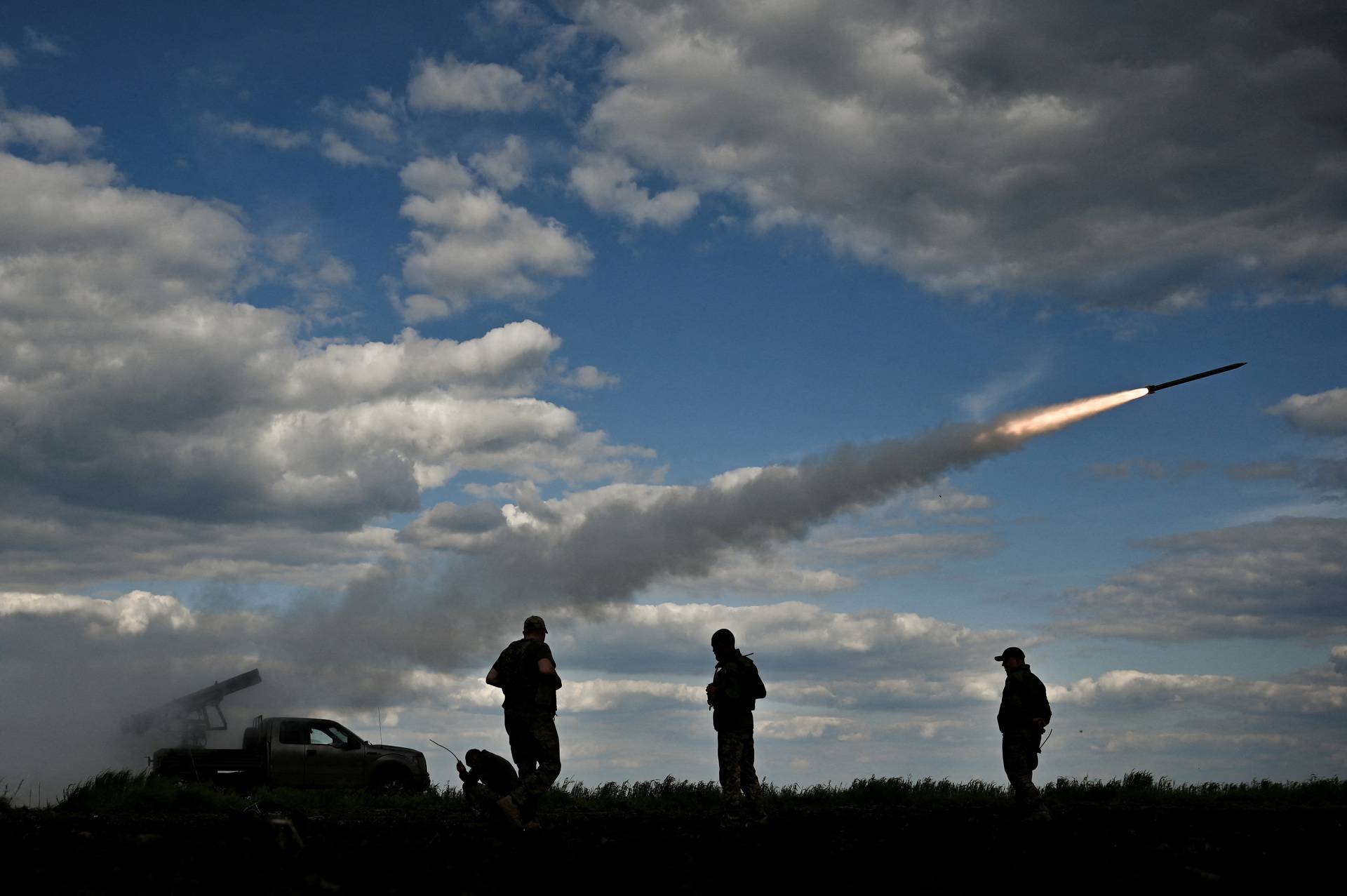 Ukrainian servicemen fire a Partyzan multiple launch rocket system towards Russian troops near a frontline in Zaporizhzhia region