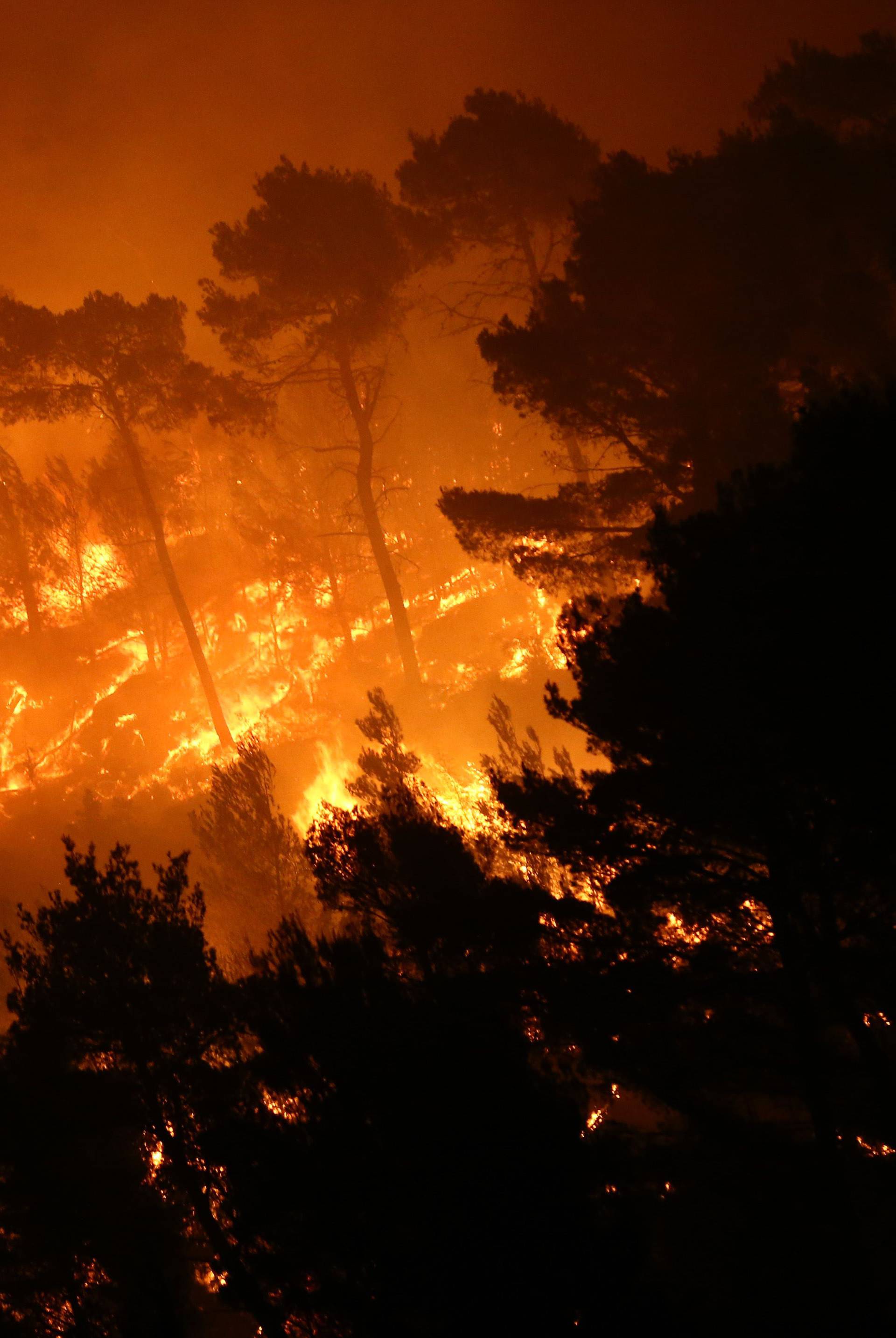 A wildfire is seen in the village of Mravince near Split