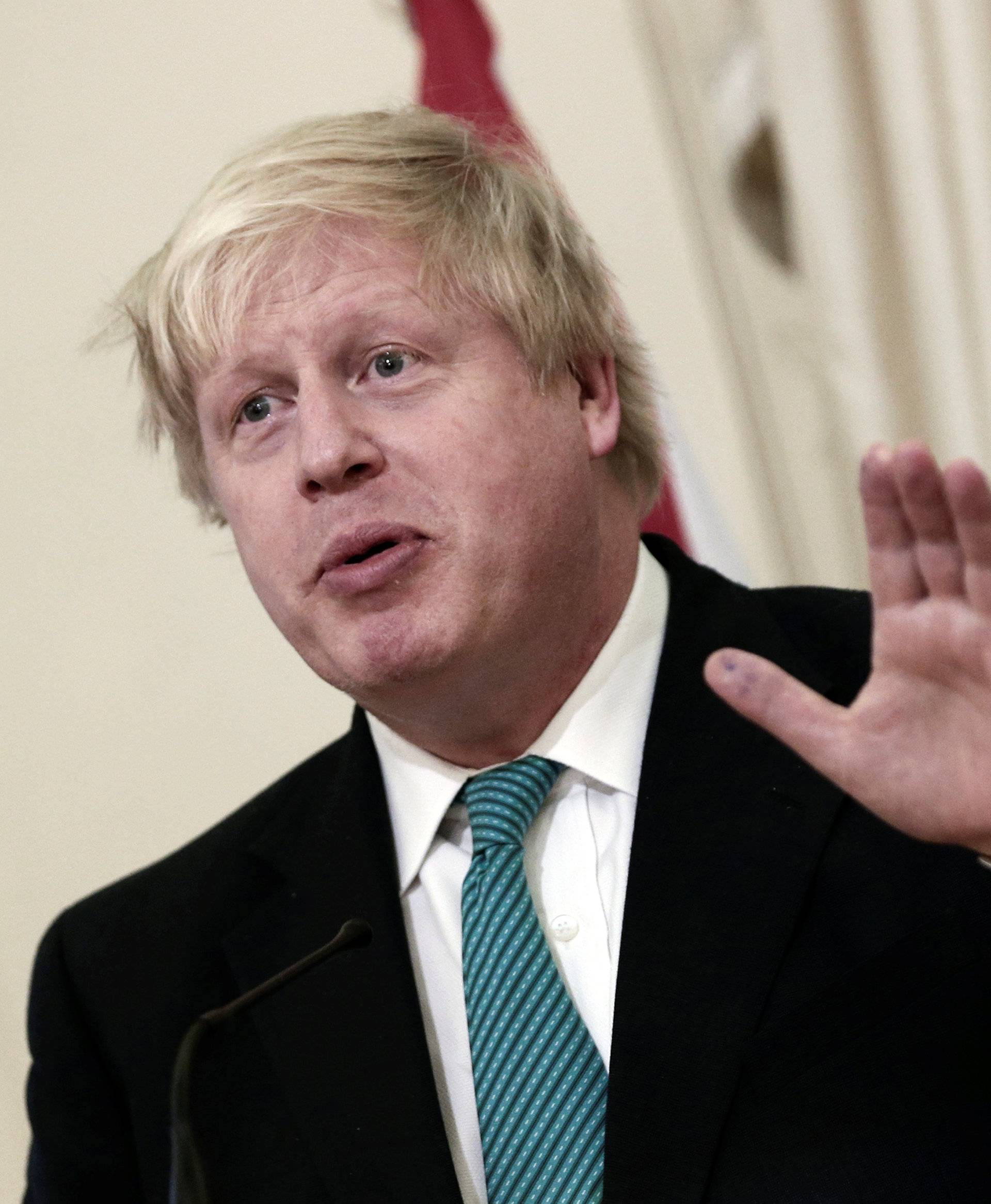 British Foreign Secretary Johnson answers a question during a joint press conference with Greek Foreign Minister Kotzias following their meeting at the Foreign Ministry in Athens