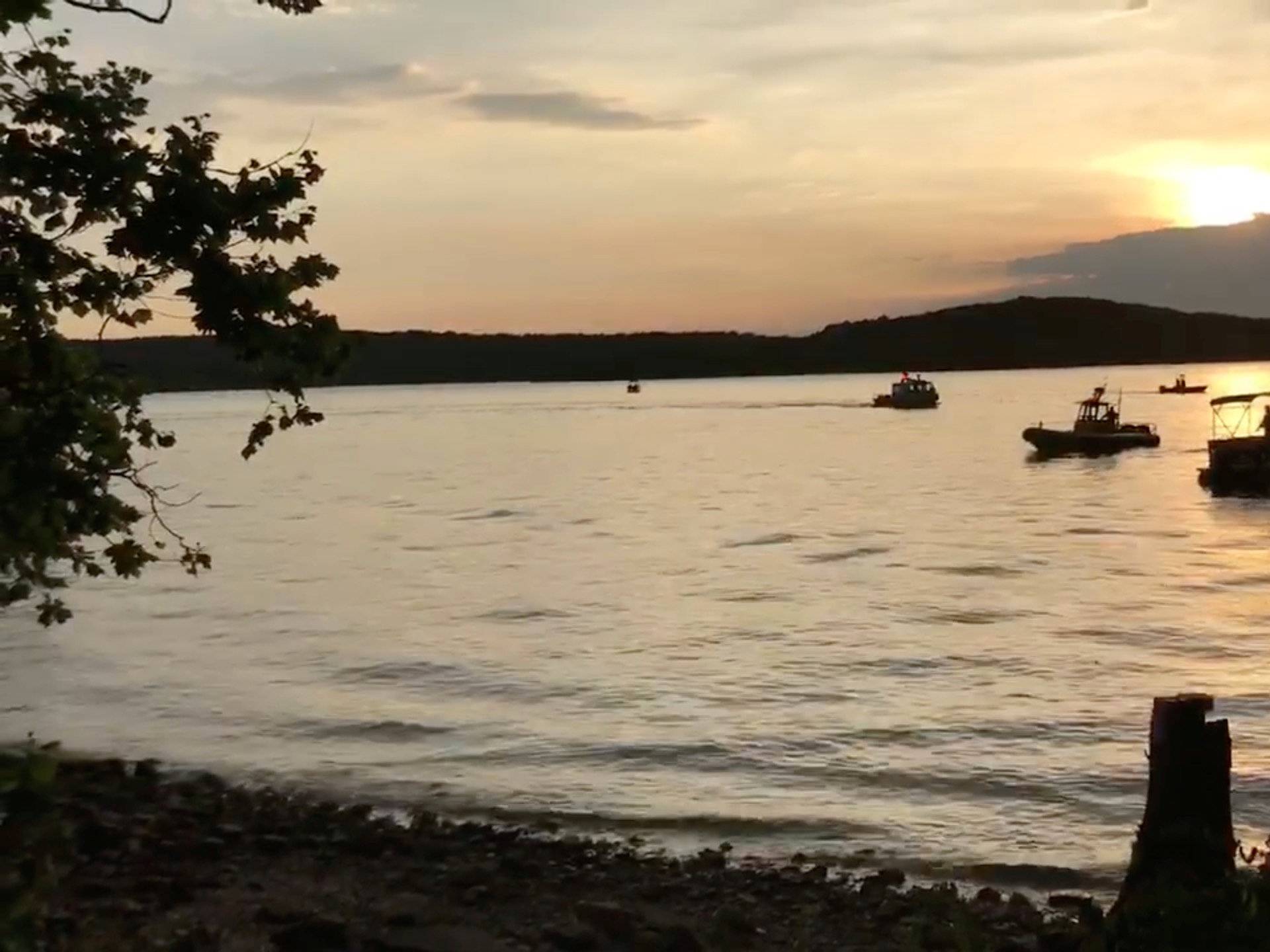 Rescue personnel work after an amphibious "duck boat" capsized and sank, at Table Rock Lake near Branson, Stone County