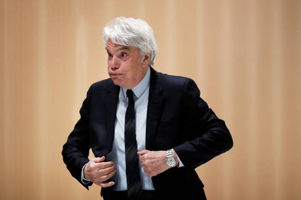 French tycoon Bernard Tapie is pictured during a suspension of the trial over a disputed state payment at the Paris courthouse