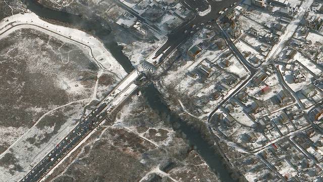 A satellite image shows a damaged bridge over Irpin River in Irpin