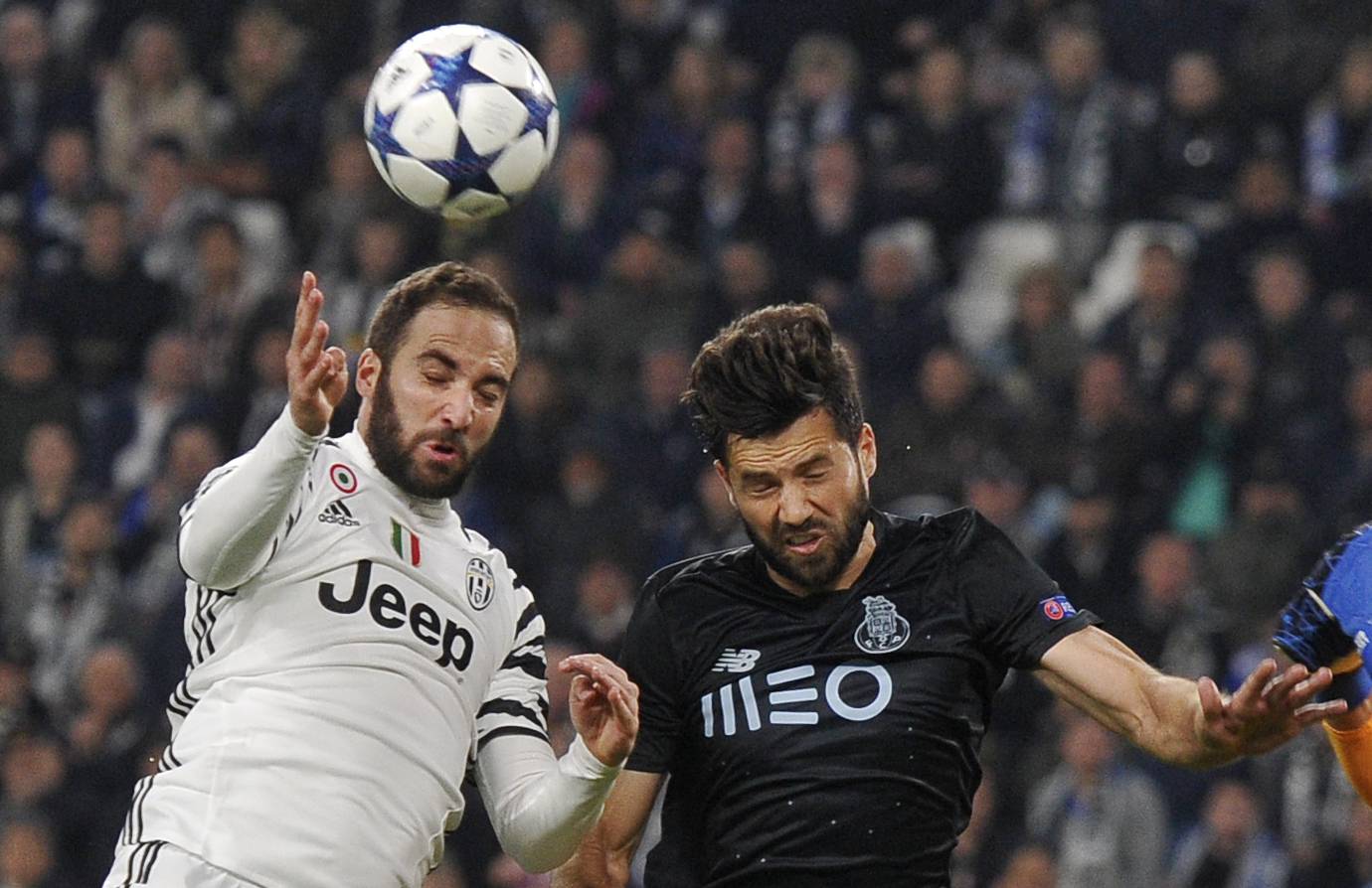 FC Porto's Miguel Layun in action with Juventus' Gonzalo Higuain