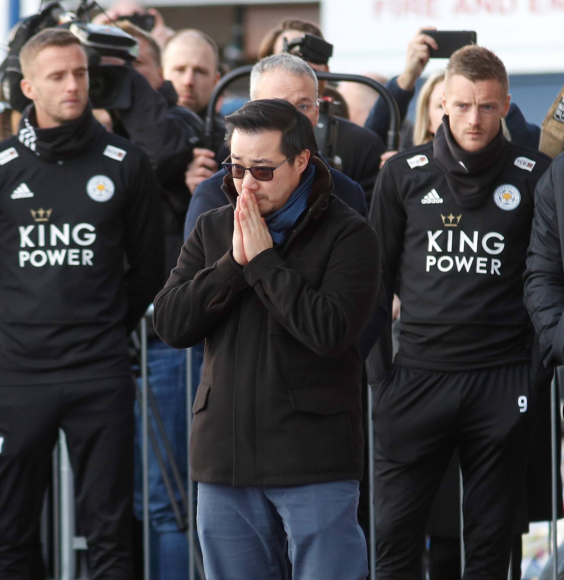 Son of Leicester City's owner Thai businessman Vichai Srivaddhanaprabha, and players look at tributes left for Vichai and four other people who died when the helicopter they were travelling in crashed in Leicester