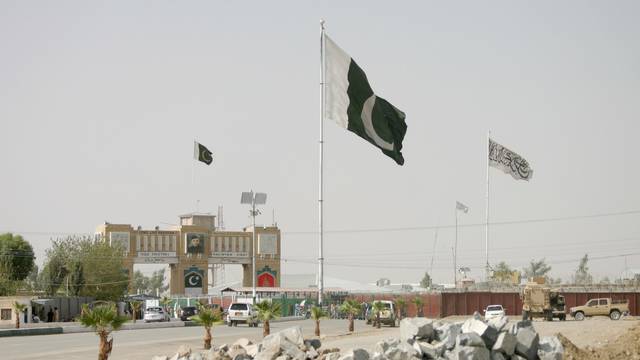 FILE PHOTO: General view of Pakistan and Taliban flags at the Friendship Gate crossing point in the Pakistan-Afghanistan border town of Chaman