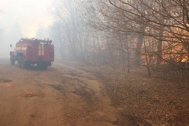 A fire truck is seen at the site of a fire burning in the exclusion zone around the Chernobyl nuclear power plant, in Kiev region