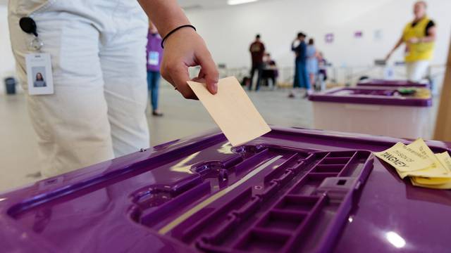 Voters are seen during a visit to an early voting centre ahead of the Indigenous voice to parliament referendum, in Perth