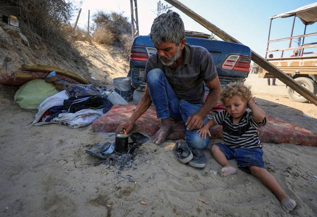 Gaza woman gives birth prematurely while fleeing, loses newborn twins
