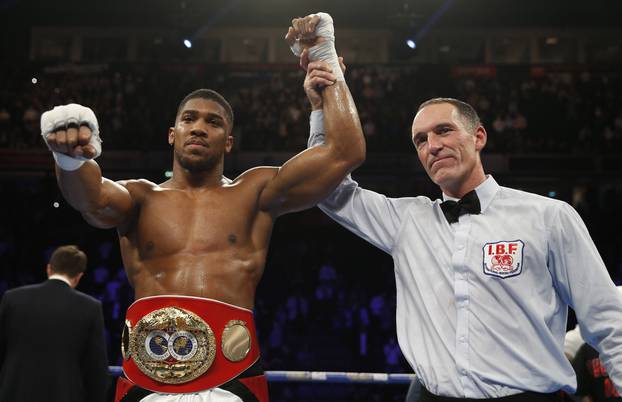 Anthony Joshua celebrates his win