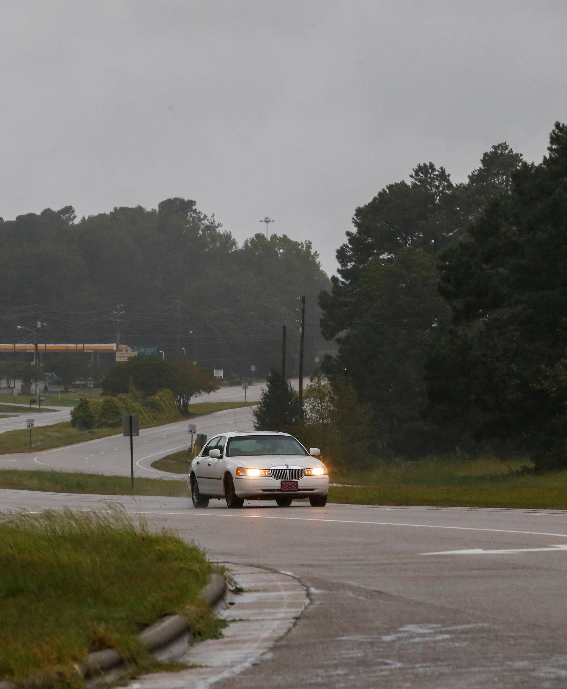 People drive along a local road as winds from Hurricane Florence hit the town of Wilson, North Carolina