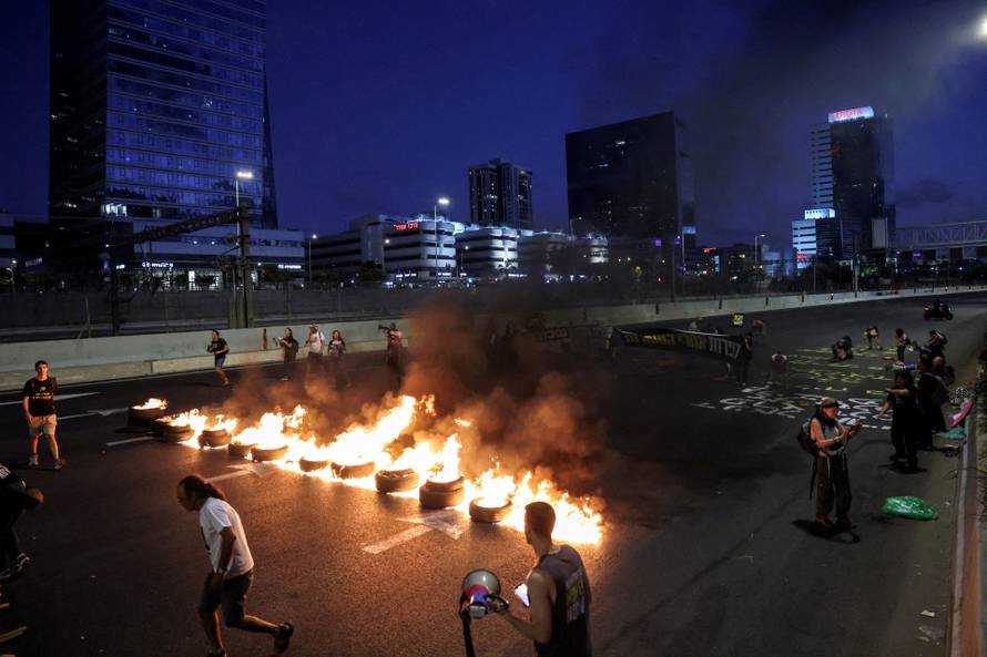 Families and supporters of hostages protest demanding the immediate release of hostages who were kidnapped during the deadly October 7 attack, amid the ongoing conflict in Gaza between Israel and Hamas, in Tel Aviv