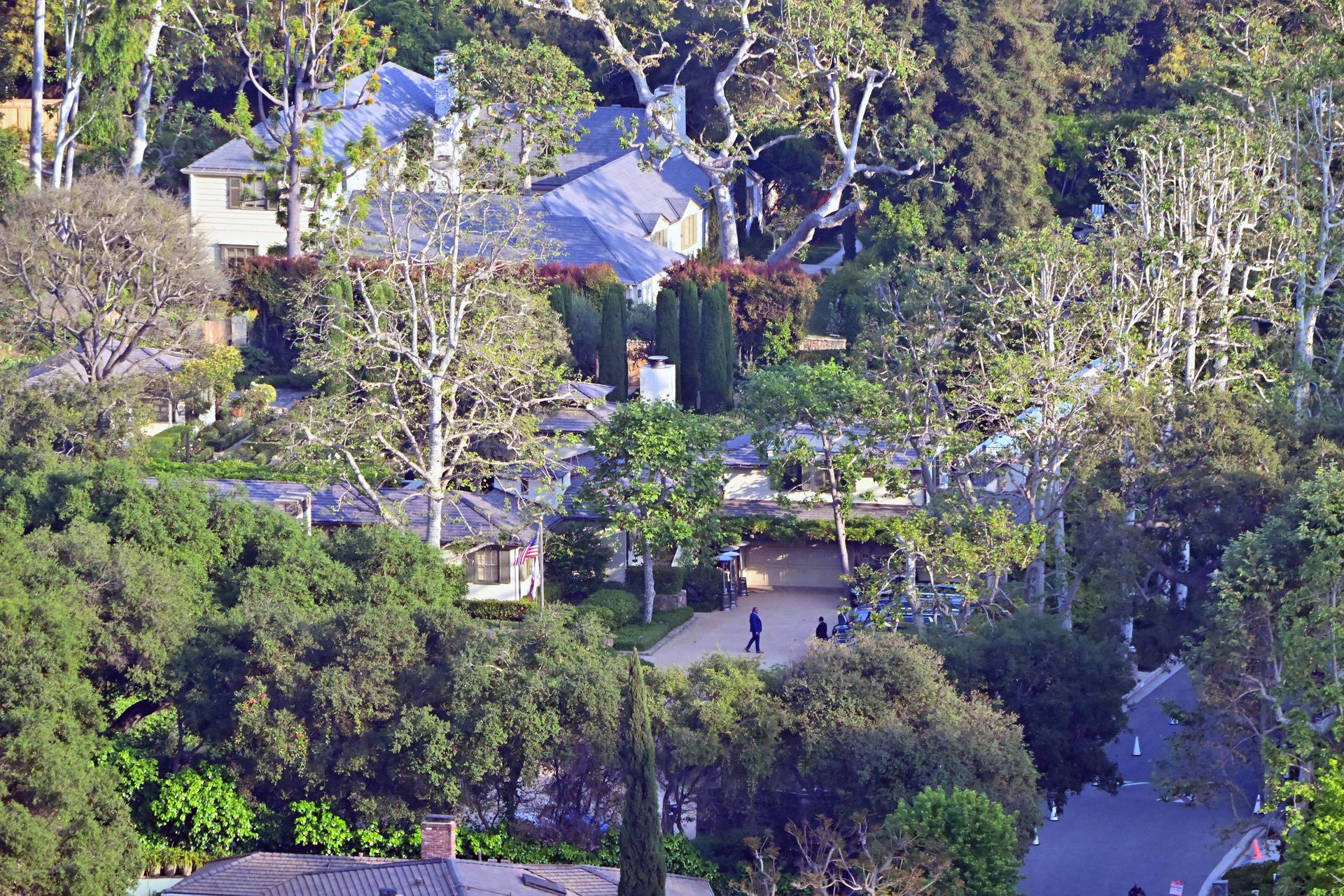 Guests are seen arriving at the wedding of Rupert Murdoch and Elena Zhukova at Murdoch's Bel Air home