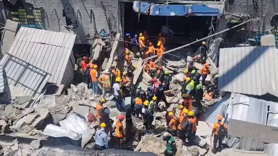 Rescuers work at the site of the collapsed Jet Set nightclub in Santo Domingo