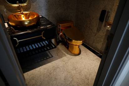 A gold plated bathroom sink and a gold plated toilet are seen in the newly-inaugurated Dolce Hanoi Golden Lake luxury hotel, after the government eased a nationwide lockdown following the global outbreak of the coronavirus disease (COVID-19), in Hanoi