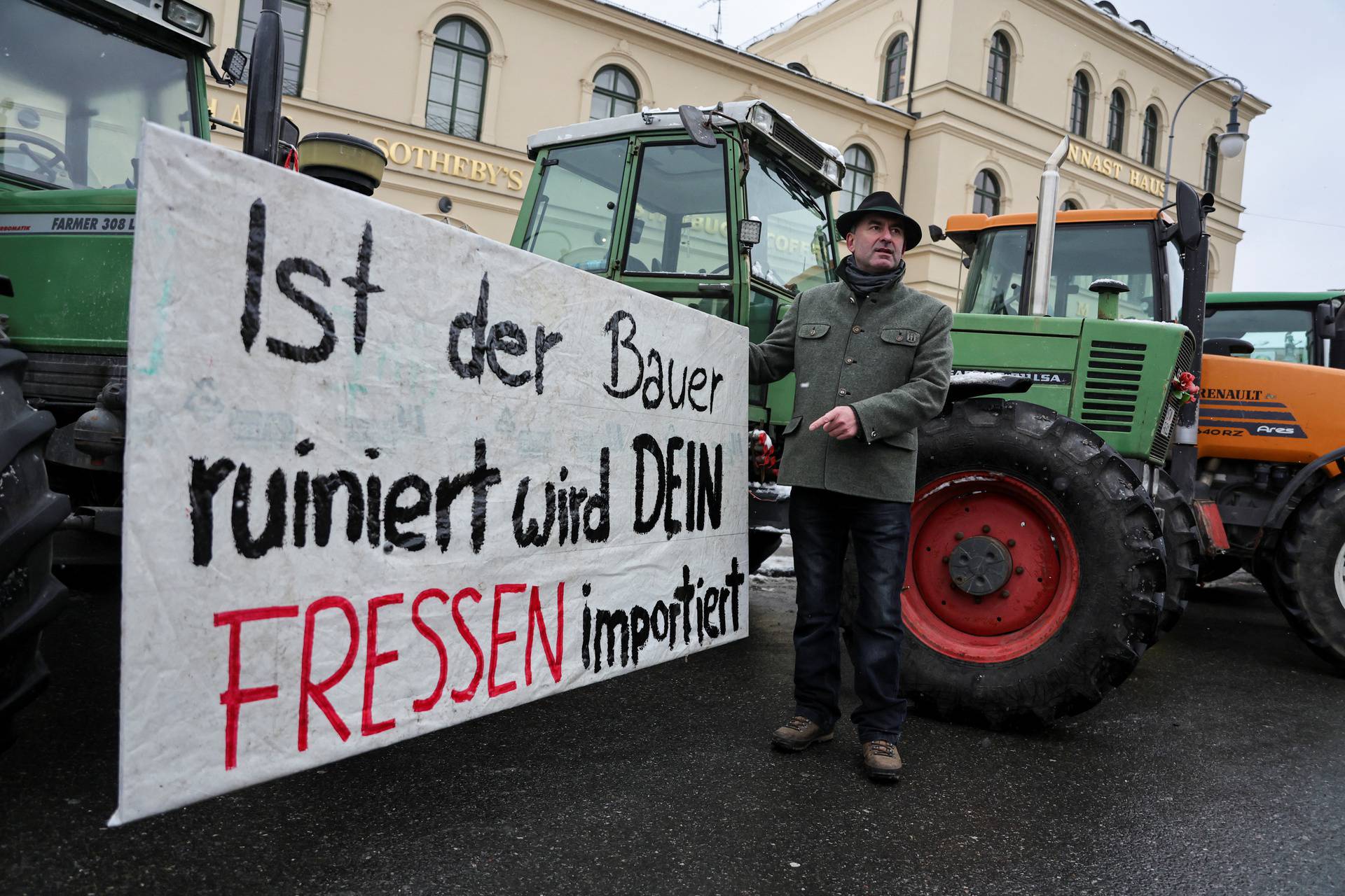 German farmers take part in a protest against the cut of vehicle tax subsidies