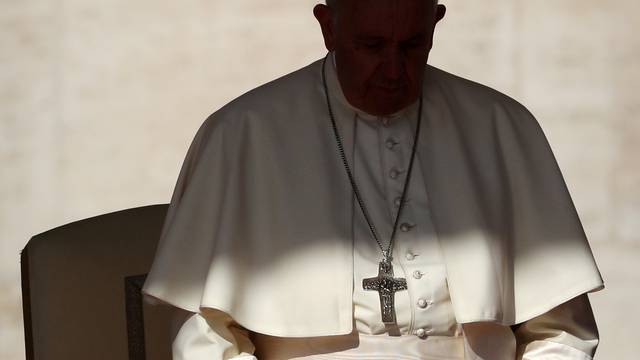 FILE PHOTO: Pope Francis arrives to lead the Wednesday general audience in Saint Peter's square at the Vatican