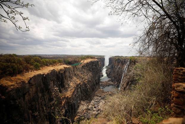 Spray rises up in the distance along the parched gorge on the Zambian side of Victoria Falls