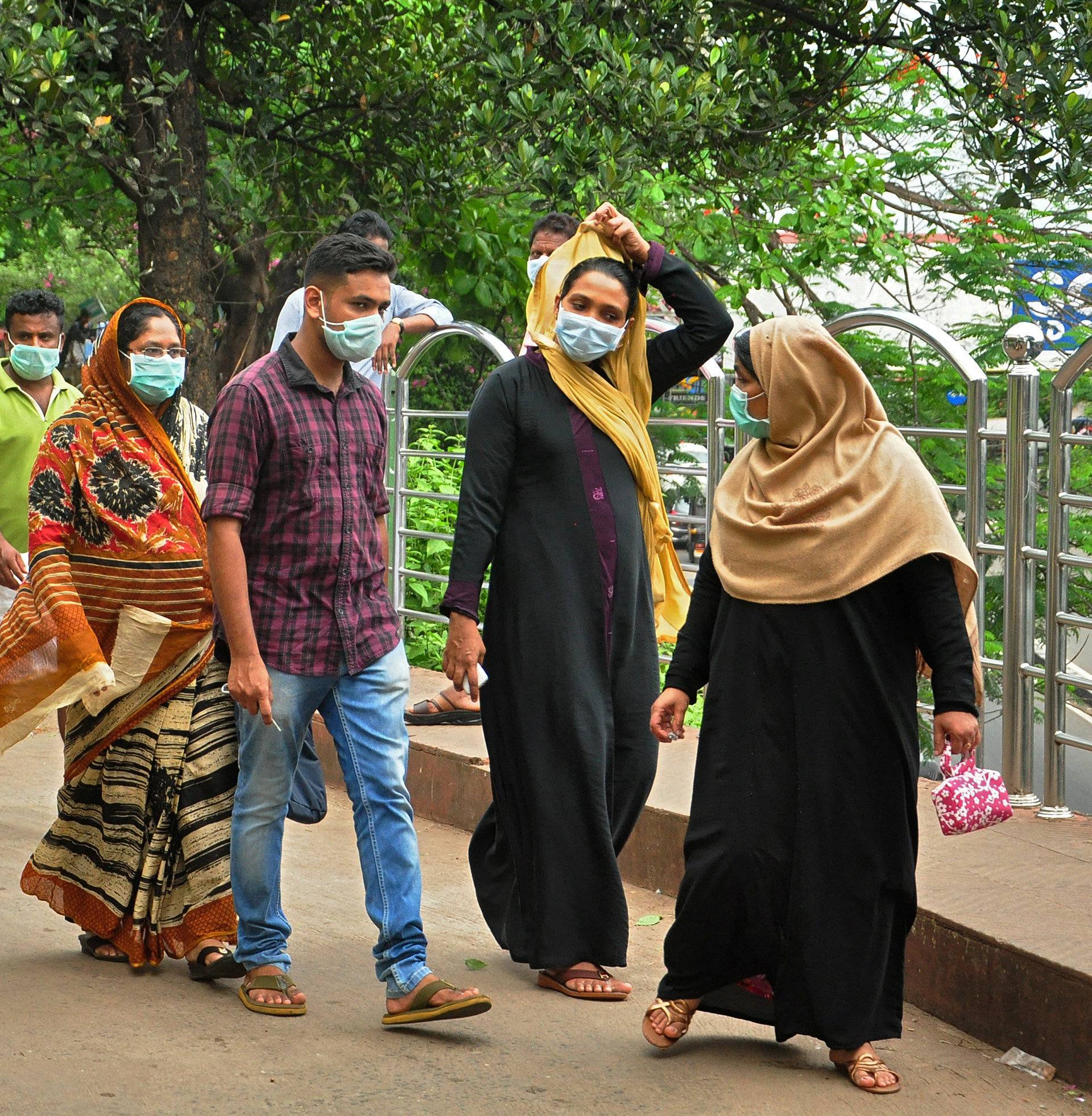 People wearing masks are seen at a hospital in Kozhikode in the southern state of Kerala