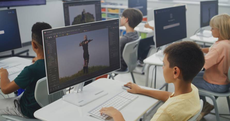 Smart,Young,Students,Using,Computers,,Creating,Game,Characters,In,Design