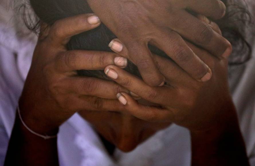 The mother of Shaini, 13, who died as bomb blasts ripped through churches and luxury hotels on Easter, mourns at her wake, in Negombo