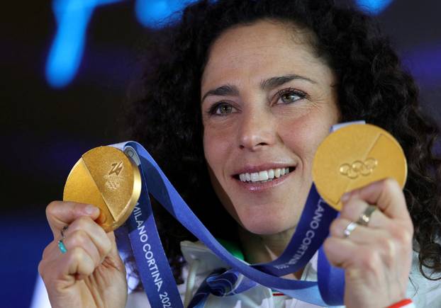 FILE PHOTO: Italy's alpine skier Federica Brignone shows her two gold medals after a press conference in Cortina d'Ampezzo