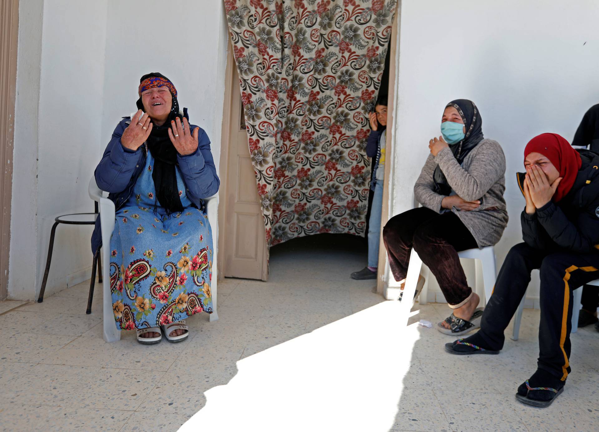 Gamra, the mother of Brahim Aouissaoui, who is suspected of carrying out Thursday's attack in Nice, France, reacts at her home in Thina, a suburb of Sfax, Tunisia