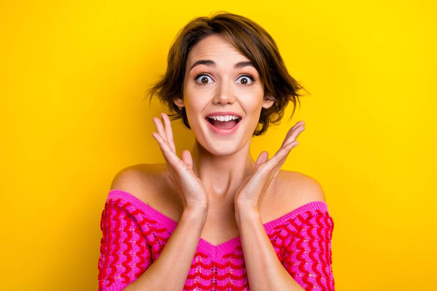 Photo of cute impressed girl bob hairstyle dressed off shoulder shirt staring at unexpected discount isolated on yellow color background