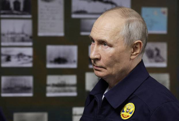 Russian President Vladimir Putin observes a military drill of Pacific fleet in Sakhalin region