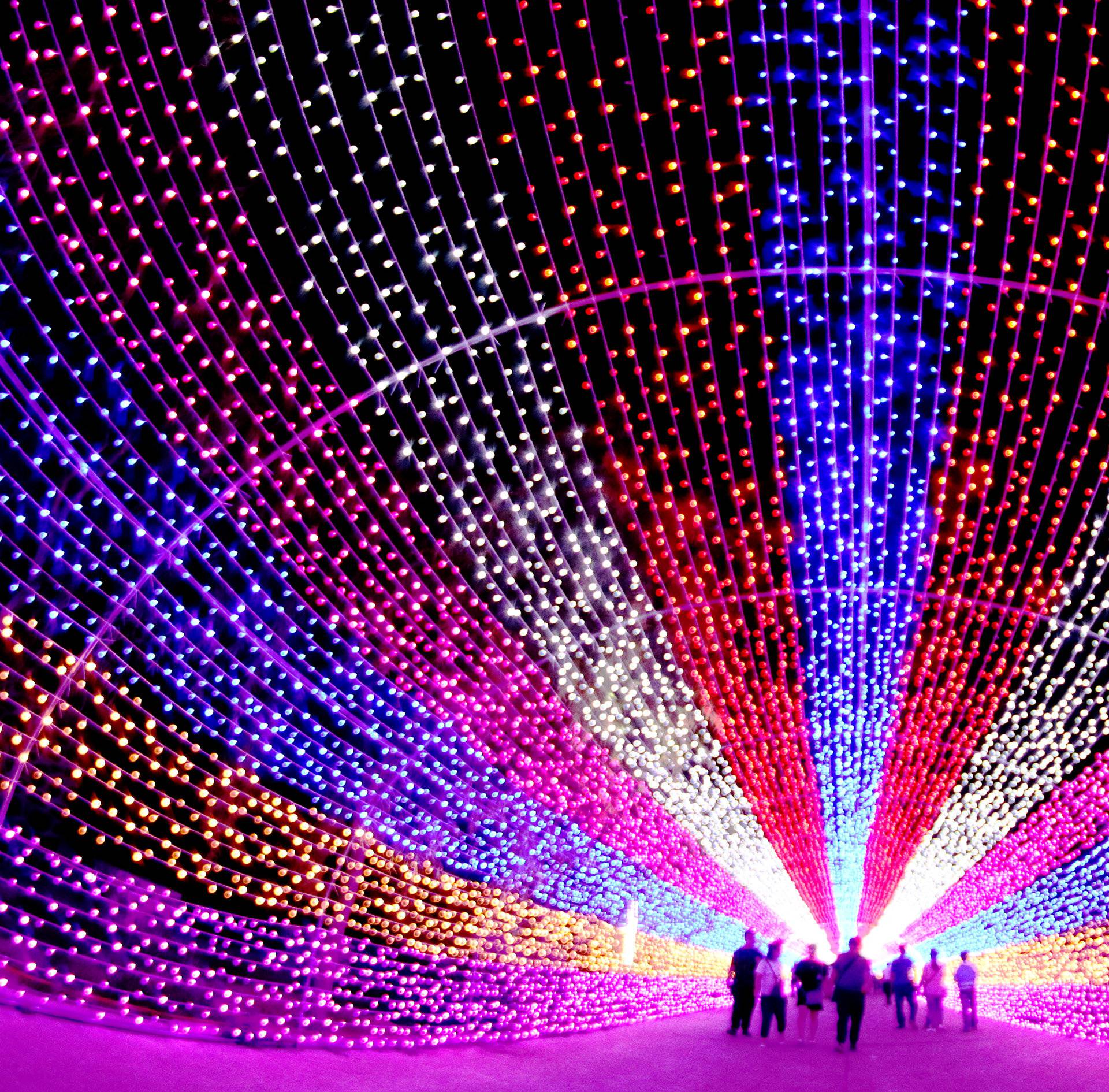 Tourists walk through a lantern installation in Zhangjiakou