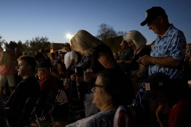 Catholics from across the Phoenix area gather to pray for Charlie Kirk, who was shot and killed in Utah, at Desert Horizon Park in Scottsdale