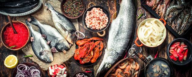 Different seafood with shrimps and red caviar.