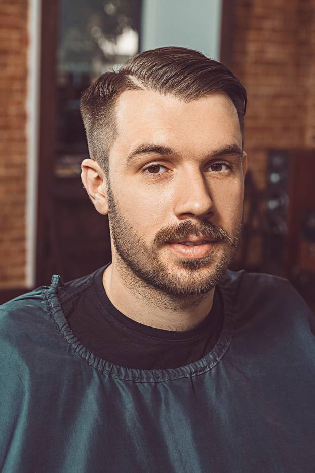 The young man looking at camera