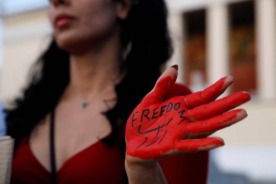 FILE PHOTO: Demonstrators take part in a protest following the death of Mahsa Amini, in Athens