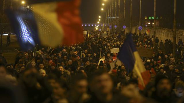 People demonstrate against cabinet decree passed earlier in week decriminalising some graft offences, in Bucharest