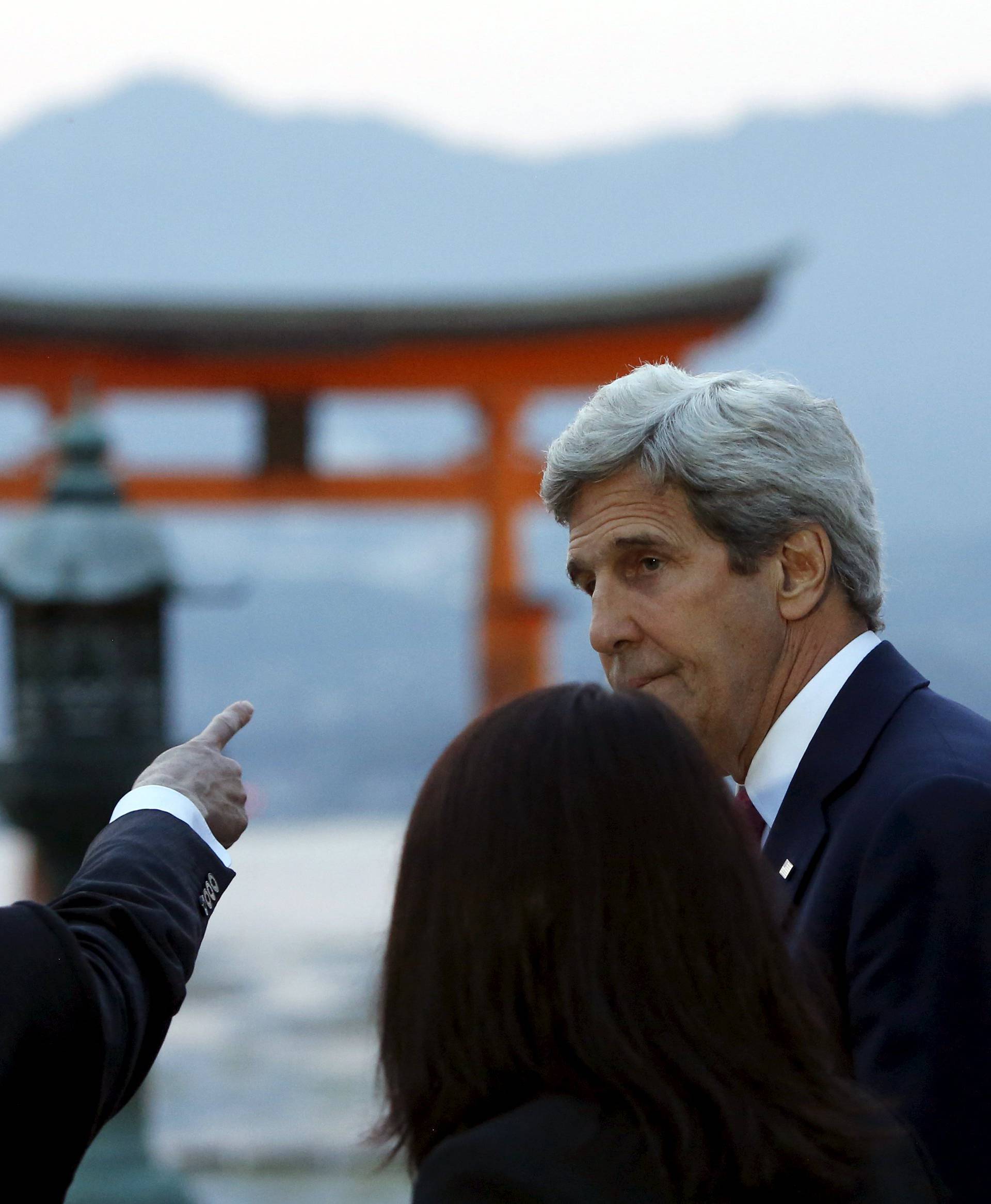 Kerry listens to Kishida as they and G7 foreign ministers visit the Itsukushima Shrine as they take a cultural break from their meetings in nearby Hiroshima to visit Miyajima Island