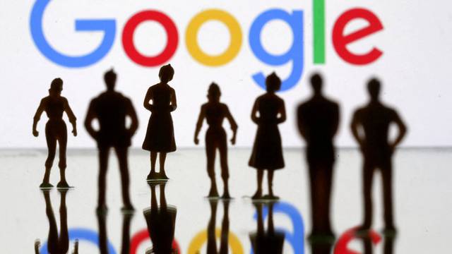 FILE PHOTO: Small toy figures are seen in front of Google logo in this illustration picture