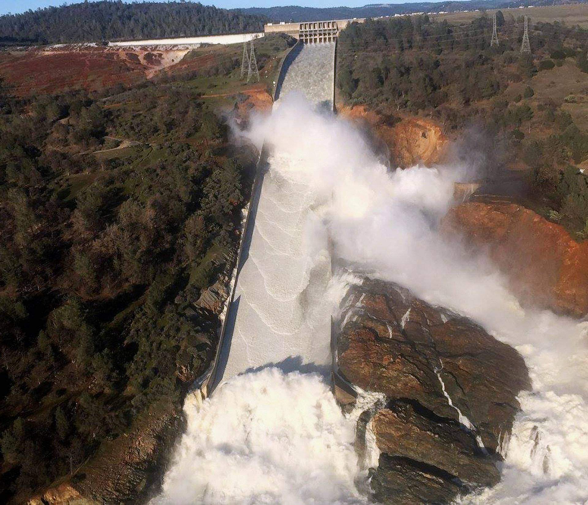 File Photo: A damaged spillway with eroded hillside is seen in an aerial photo taken over the Oroville Dam in Oroville