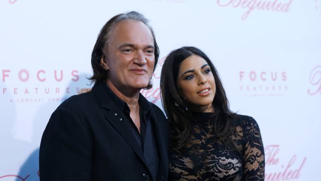 Director Tarantino and Daniela Pick pose at a premiere for "The Beguiled" in LA
