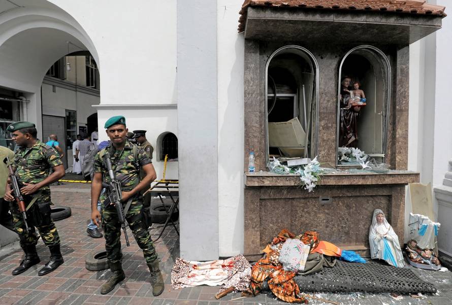 Sri Lankan military officials stand guard in front of the St. Anthony's Shrine, Kochchikade church after an explosion in Colombo