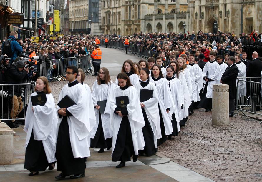 Members of the church choir arrive at Great St Marys Church, where the funeral of theoretical physicist Prof Stephen Hawking is being held, in Cambridge